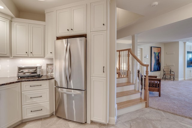 11 Clark Island Rd, Amherst, NH 03031 - kitchen featuring freestanding refrigerator, dark stone countertops, white cabinetry, baseboards, and light carpet