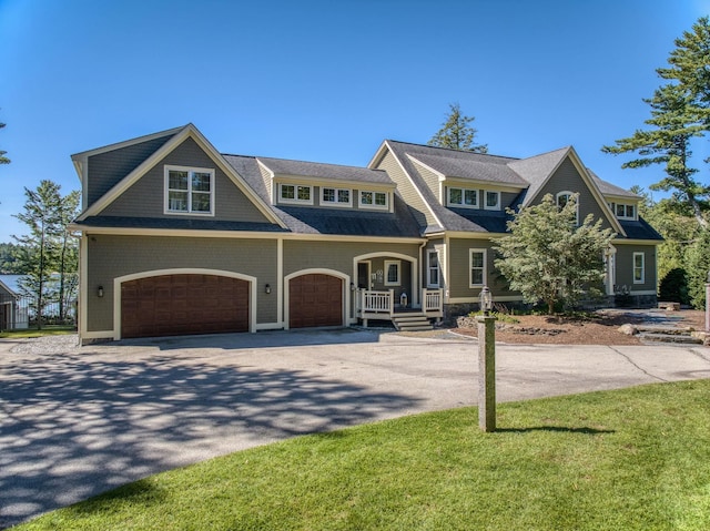 11 Clark Island Rd, Amherst, NH 03031 - shingle-style home with driveway and a garage