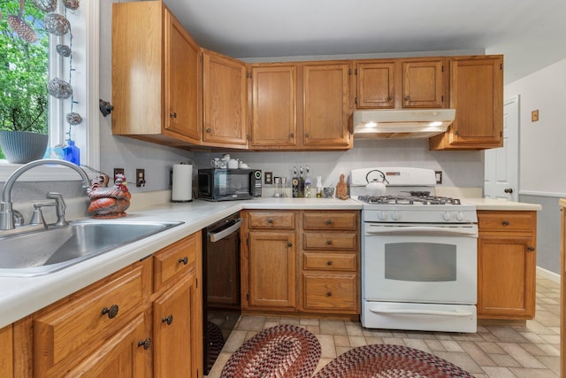 37 Thorndike Rd, Weare, NH 03281 - kitchen with black appliances, under cabinet range hood, a sink, light countertops, and brown cabinetry