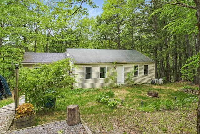 37 Thorndike Rd, Weare, NH 03281 - view of front of property featuring an outdoor fire pit and a shingled roof