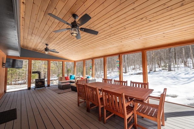 15 Spring Hill Rd, Dover, VT 05356 - sunroom featuring a wood stove, wooden ceiling, an outdoor living space, lofted ceiling, and a ceiling fan