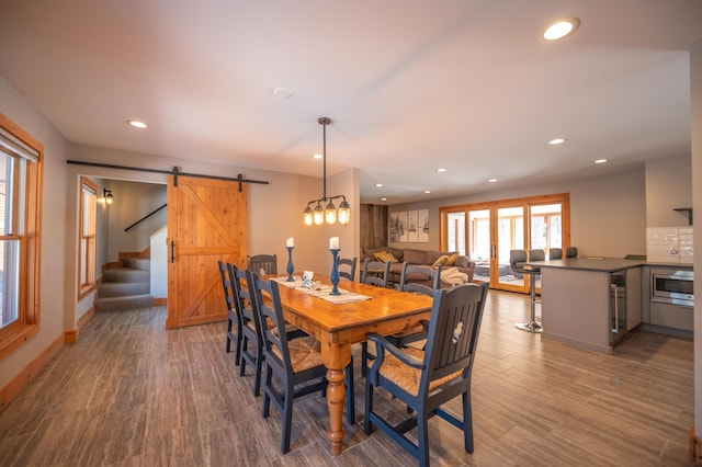 15 Spring Hill Rd, Dover, VT 05356 - dining space with recessed lighting, dark wood-type flooring, a barn door, stairs, and baseboards