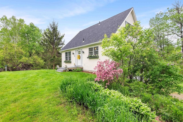 312 Browns Trce, Jericho, VT 05465 - back of house with a lawn and roof with shingles
