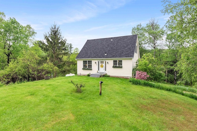 312 Browns Trce, Jericho, VT 05465 - cape cod house featuring a front yard and roof with shingles