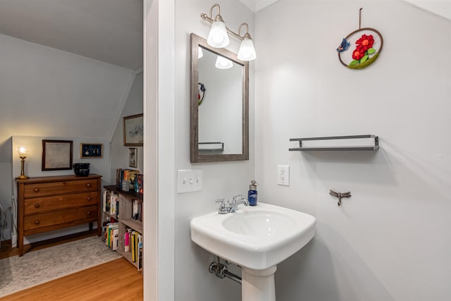 312 Browns Trce, Jericho, VT 05465 - bathroom featuring wood finished floors, vaulted ceiling, and a sink