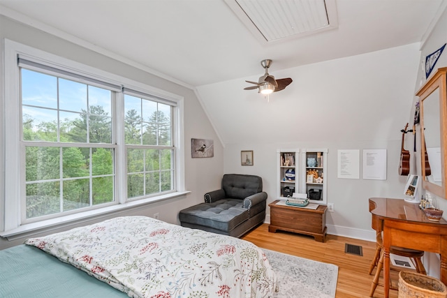 312 Browns Trce, Jericho, VT 05465 - bedroom featuring attic access, multiple windows, light wood-type flooring, lofted ceiling, and baseboards