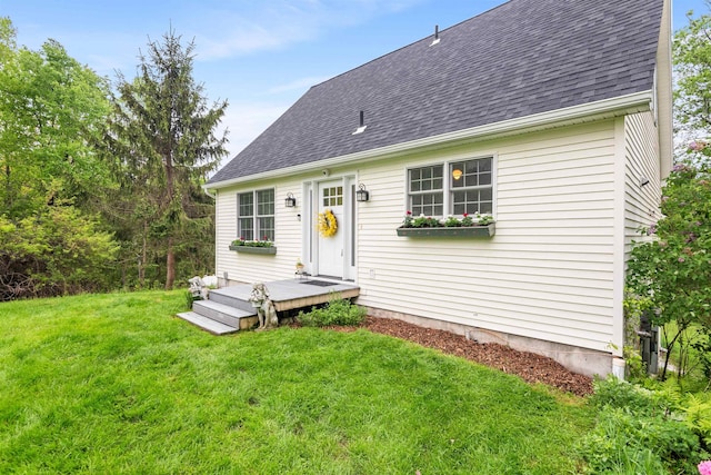 312 Browns Trce, Jericho, VT 05465 - rear view of house featuring roof with shingles, a lawn, and a deck