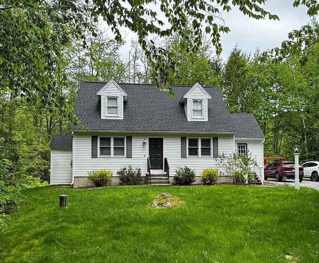 10 Irving Dr, Weare, NH 03281 - new england style home with entry steps, a front yard, and a shingled roof