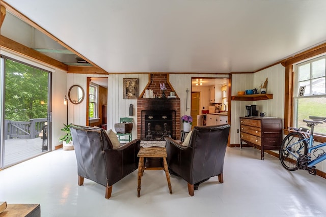26 Don Gerry Rd, Bristol, NH 03222 - living area with a fireplace, concrete floors, and wood walls