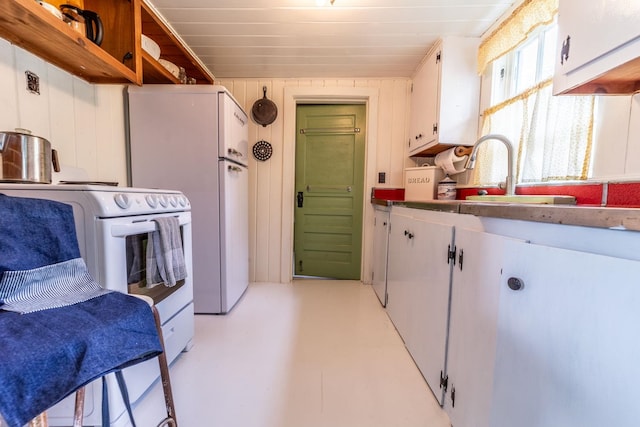 26 Don Gerry Rd, Bristol, NH 03222 - kitchen with a sink, white appliances, white cabinetry, and concrete flooring