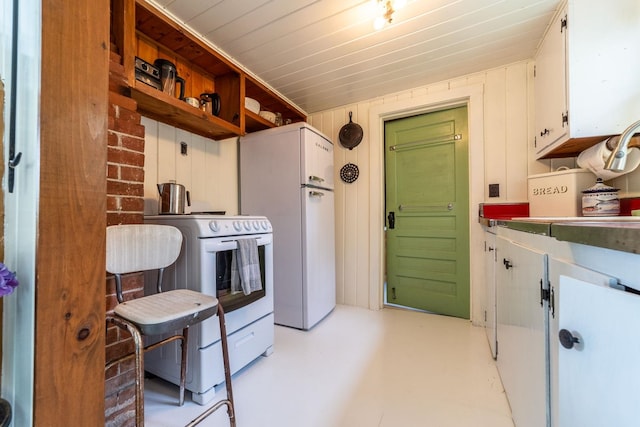 26 Don Gerry Rd, Bristol, NH 03222 - kitchen with white appliances, white cabinetry, and concrete floors