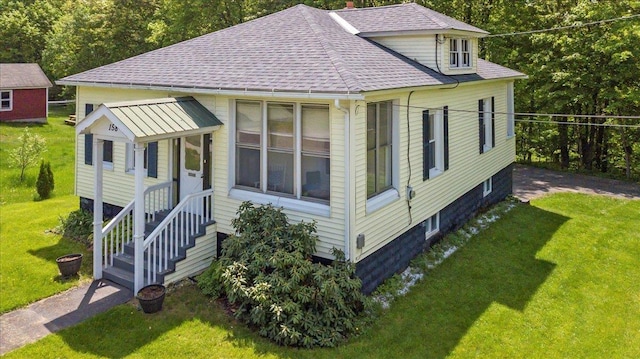 158 Clark Ave, Brattleboro, VT 05301 - view of front facade featuring roof with shingles and a front lawn