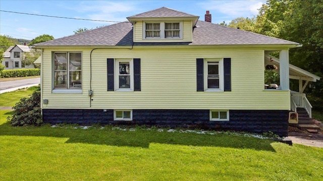 158 Clark Ave, Brattleboro, VT 05301 - view of home's exterior featuring a yard, roof with shingles, and a chimney