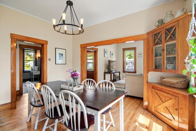 158 Clark Ave, Brattleboro, VT 05301 - dining area with plenty of natural light, light wood-style flooring, and a chandelier