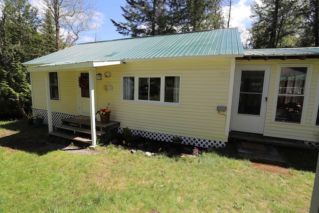 78 Daniels Pond Rd, Glover, VT 05839 - view of front facade with a front yard, entry steps, and metal roof