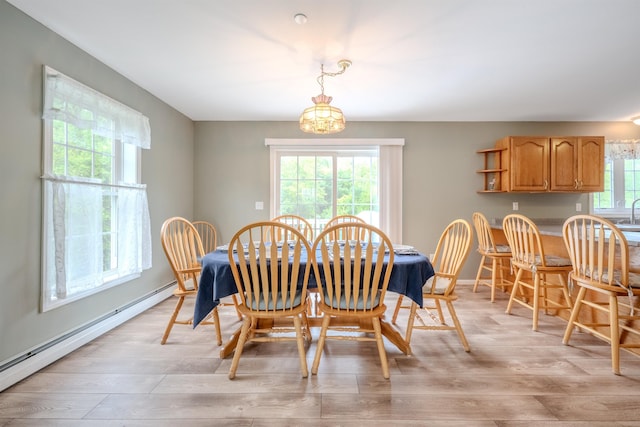 5 Saw Hill Rd, Hooksett, NH 03106 - dining room with a baseboard heating unit, light wood-style floors, a chandelier, and baseboards