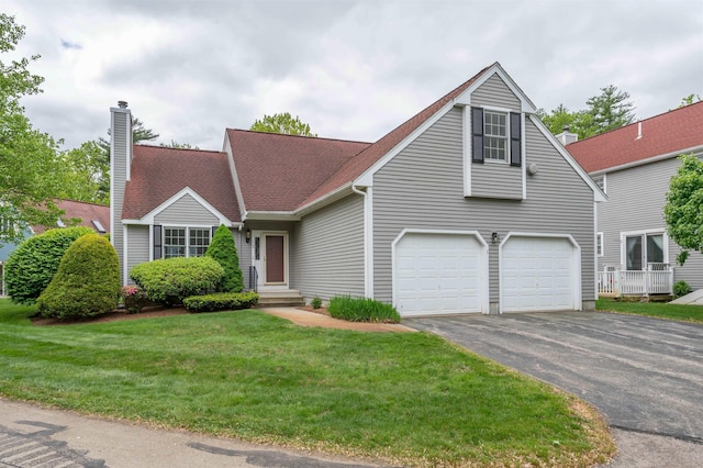 3 Harvest Ln, Nashua, NH 03063 - view of front facade featuring asphalt driveway, a chimney, a front yard, an attached garage, and roof with shingles