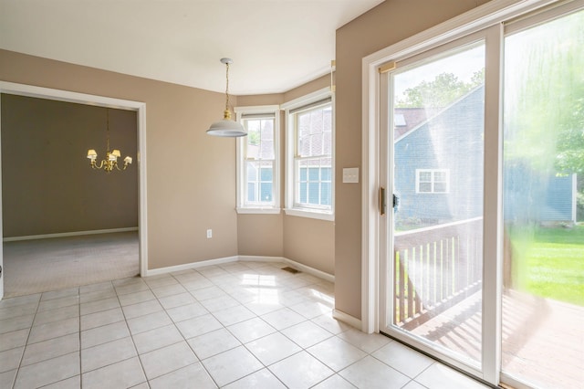 3 Harvest Ln, Nashua, NH 03063 - unfurnished dining area featuring a chandelier, baseboards, and light tile patterned floors