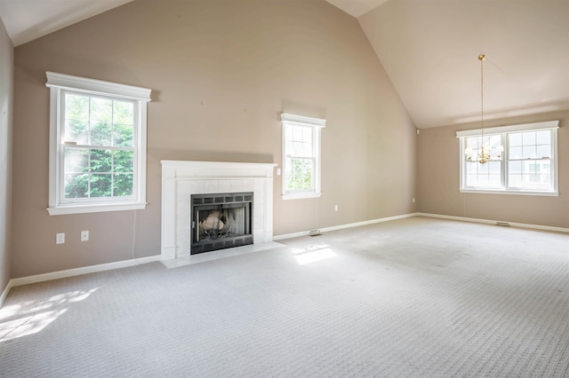 3 Harvest Ln, Nashua, NH 03063 - unfurnished living room featuring a chandelier, plenty of natural light, a tiled fireplace, carpet, and high vaulted ceiling