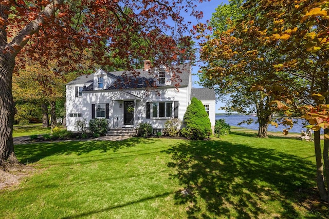 354 Dover Point Rd, Dover, NH 03820 - view of front of home featuring a front yard, a water view, and a chimney