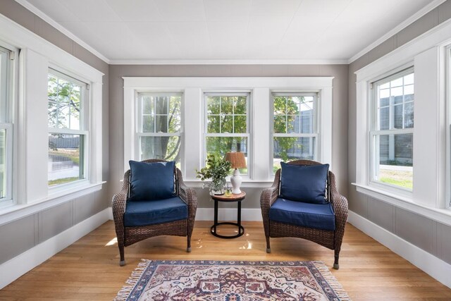 354 Dover Point Rd, Dover, NH 03820 - living area featuring plenty of natural light, light wood-style flooring, and ornamental molding