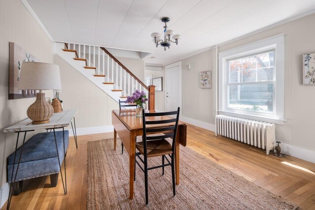 354 Dover Point Rd, Dover, NH 03820 - dining room featuring radiator, stairs, hardwood / wood-style flooring, and baseboards