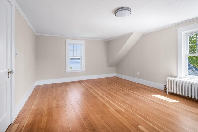 354 Dover Point Rd, Dover, NH 03820 - bonus room featuring radiator heating unit, light wood-style floors, and baseboards