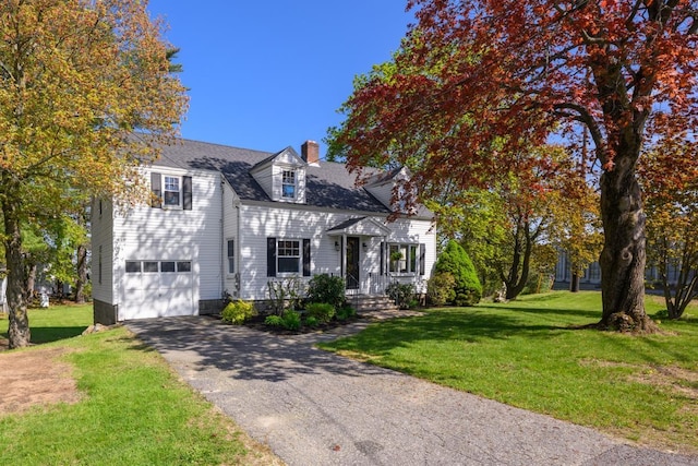 354 Dover Point Rd, Dover, NH 03820 - view of front of property with asphalt driveway, a chimney, an attached garage, and a front yard
