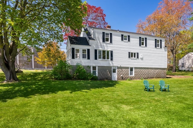 354 Dover Point Rd, Dover, NH 03820 - rear view of house featuring a yard and a chimney