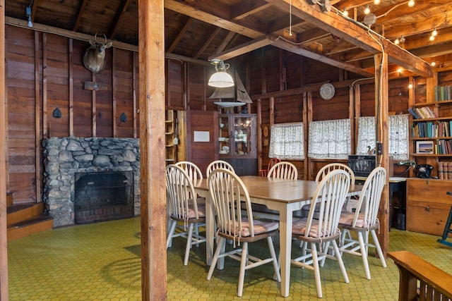 17 Hayes Ln, Acton, ME 04001 - dining room with wood walls, a stone fireplace, and vaulted ceiling