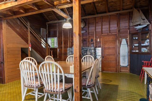 17 Hayes Ln, Acton, ME 04001 - dining area with wood walls, tile patterned floors, and lofted ceiling