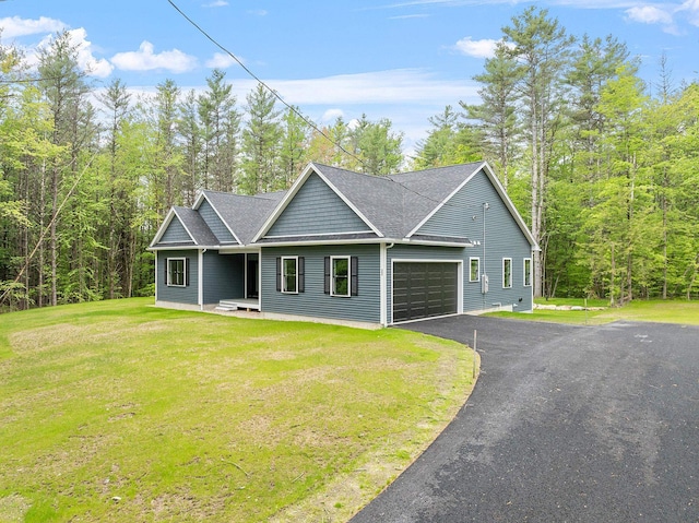 380 Greenfield Rd, Peterborough, NH 03458 - view of front of home featuring an attached garage, asphalt driveway, a front yard, and roof with shingles
