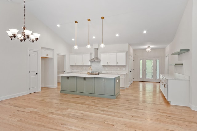 380 Greenfield Rd, Peterborough, NH 03458 - kitchen featuring wall chimney exhaust hood, white cabinetry, light wood-style flooring, light countertops, and recessed lighting