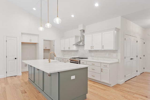 380 Greenfield Rd, Peterborough, NH 03458 - kitchen featuring gas range, wall chimney range hood, white cabinets, light wood finished floors, and recessed lighting