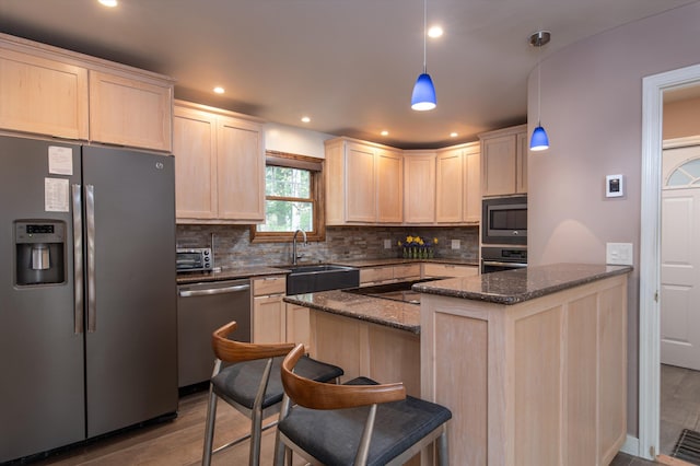 31 Plumley Ave, Ludlow, VT 05149 - kitchen with stainless steel appliances, a sink, light brown cabinetry, wood finished floors, and recessed lighting