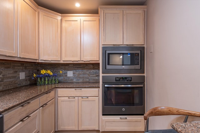 31 Plumley Ave, Ludlow, VT 05149 - kitchen with appliances with stainless steel finishes, decorative backsplash, light brown cabinets, dark stone counters, and recessed lighting