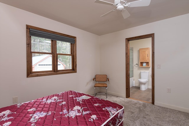 31 Plumley Ave, Ludlow, VT 05149 - carpeted bedroom featuring connected bathroom, baseboards, and a ceiling fan
