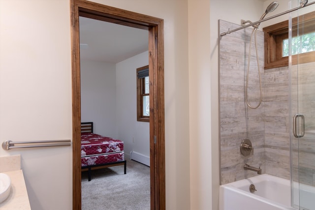 31 Plumley Ave, Ludlow, VT 05149 - bathroom with a baseboard heating unit, bath / shower combo with glass door, vanity, ensuite bathroom, and baseboards