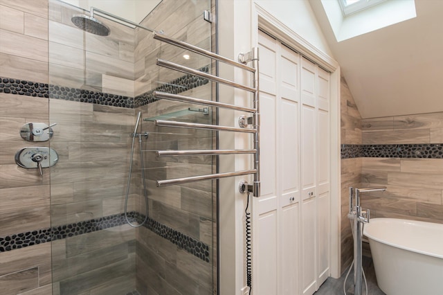 31 Plumley Ave, Ludlow, VT 05149 - full bathroom with a skylight, a stall shower, lofted ceiling, and a soaking tub