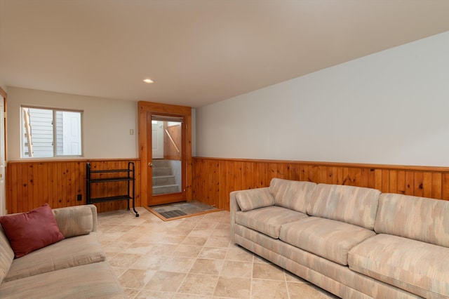 31 Plumley Ave, Ludlow, VT 05149 - living area featuring a wainscoted wall, wood walls, stairs, and recessed lighting
