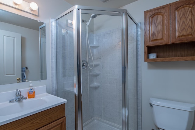 31 Plumley Ave, Ludlow, VT 05149 - bathroom featuring vanity, toilet, and a shower stall