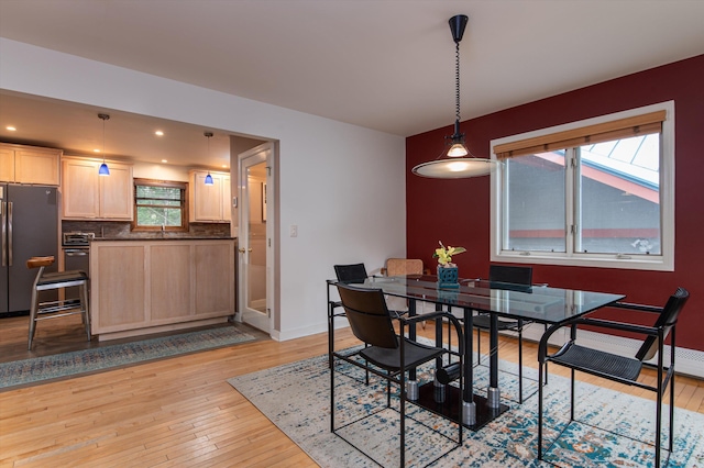 31 Plumley Ave, Ludlow, VT 05149 - dining space with light wood finished floors, plenty of natural light, baseboards, and recessed lighting