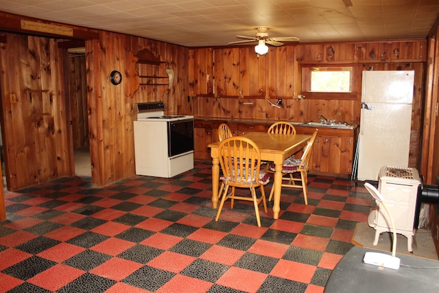 86 Concord Ln, Wakefield, NH 03830 - dining space featuring wood walls, a ceiling fan, and dark floors
