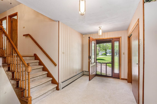 133 Pine Meadow Dr, Colchester, VT 05446 - foyer entrance featuring a baseboard radiator, light colored carpet, stairs, and baseboards
