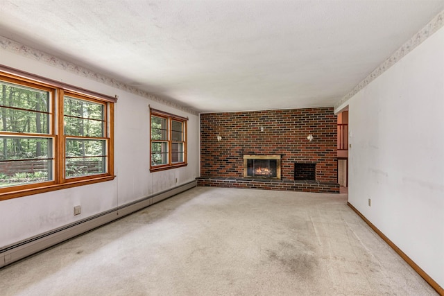 133 Pine Meadow Dr, Colchester, VT 05446 - unfurnished living room featuring a baseboard radiator, carpet floors, a fireplace, and baseboards