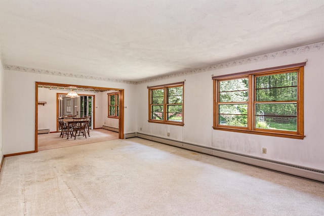 133 Pine Meadow Dr, Colchester, VT 05446 - carpeted empty room featuring a baseboard radiator and baseboards