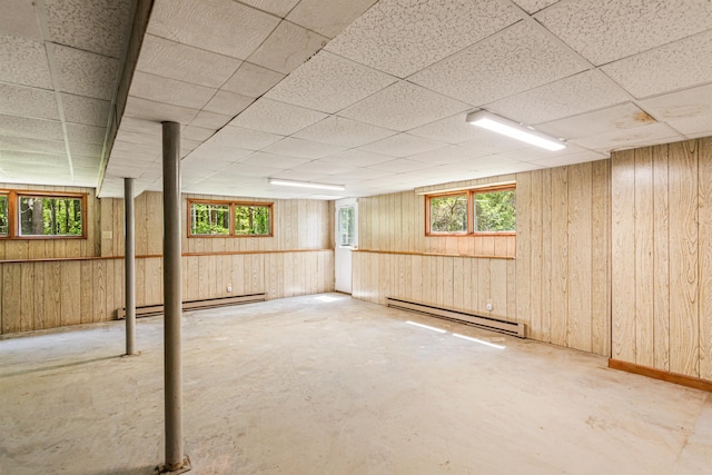 133 Pine Meadow Dr, Colchester, VT 05446 - below grade area featuring baseboard heating, a baseboard radiator, a drop ceiling, and wooden walls