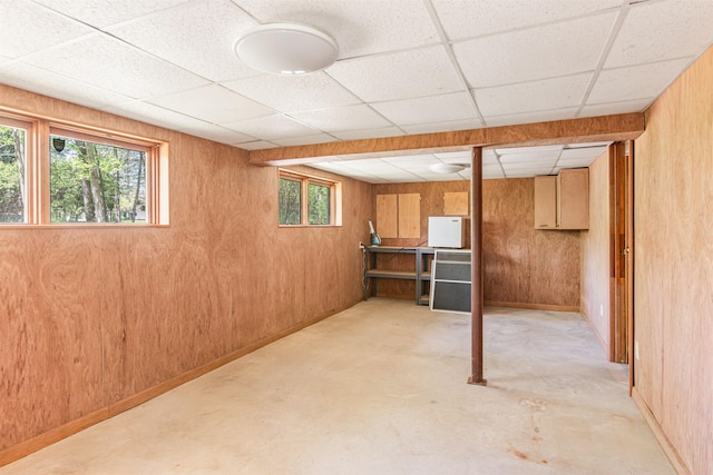 133 Pine Meadow Dr, Colchester, VT 05446 - basement featuring a paneled ceiling, healthy amount of natural light, and wooden walls