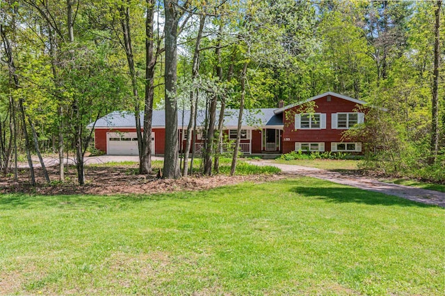 133 Pine Meadow Dr, Colchester, VT 05446 - split level home with a front yard and concrete driveway