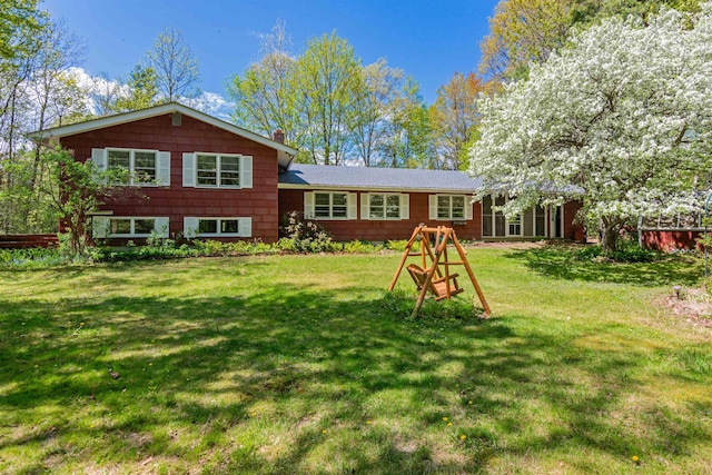 133 Pine Meadow Dr, Colchester, VT 05446 - back of house with a lawn and a chimney
